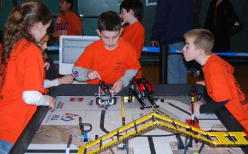 Members of the East Rockaway "Rockbots" - Team #2948 prepare to program their robot for the course at the February 28 Long Island LEGO League Tournament. Five hundred students from 48 teams participated in the event.