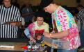 Members of the Bayport “Peaced Together” — Team #752 prepare to program their robot for the course at the March 6 Long Island LEGO League Tournament, “Body Forward.” Five hundred students from 48 teams participated in the event.